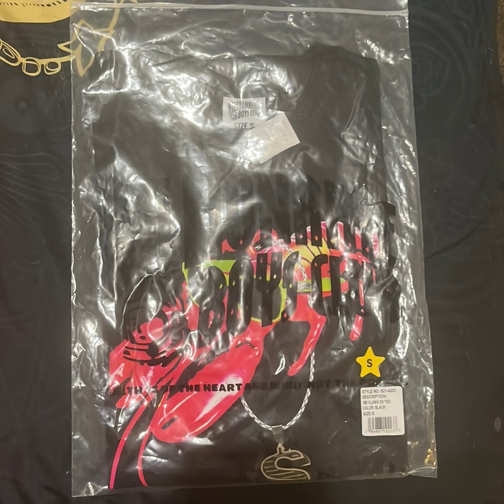 This is a black billionaire boys shirt, in the original packaging, never used.